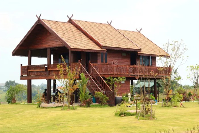 Teak houses outside says sign they make